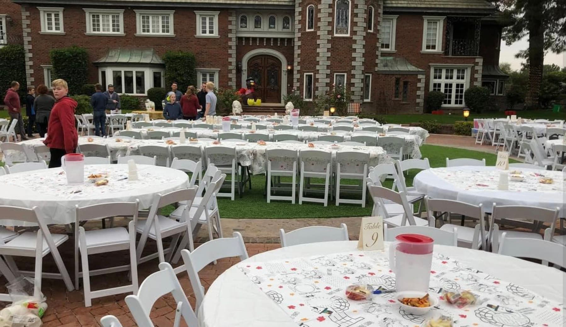Decorated banquet tables set on the lawn at The Lavender Farm at Chateau de Vie