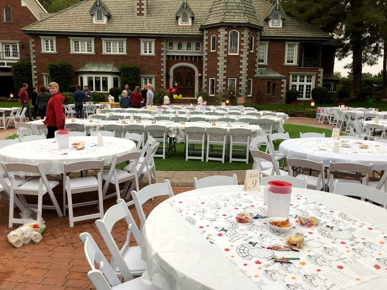 Banquet tables and a turkey mascot at the 9th Annual Kid Connection, The Lavender Farm at Chateau de Vie in Chandler